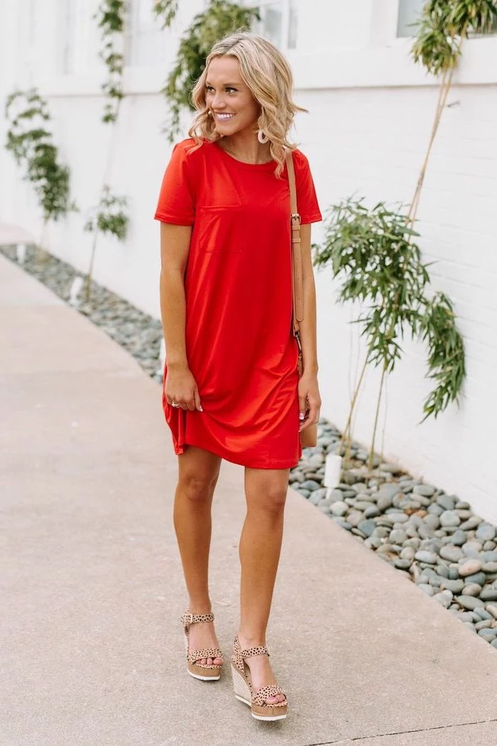 blonde woman wearing red t shirt dress platform beige sandals long summer dresses walking on sidewalk