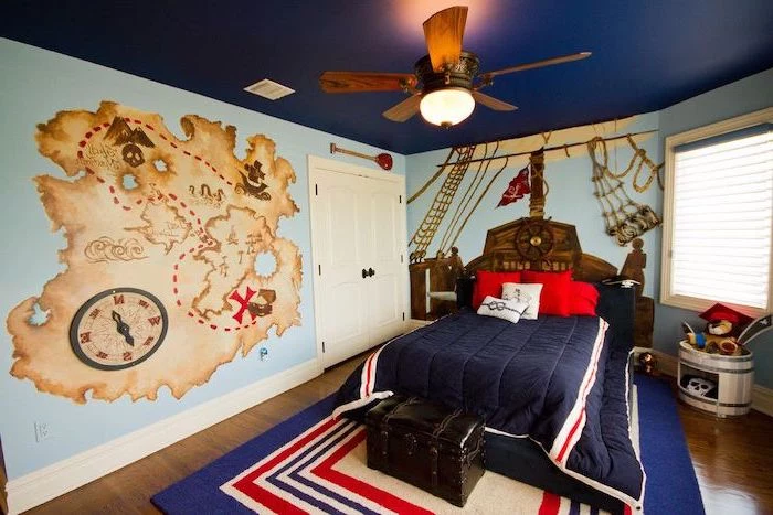 blue walls dark blue ceiling teen boy room ideas pirate themed room map ship drawn on the wall wooden floor