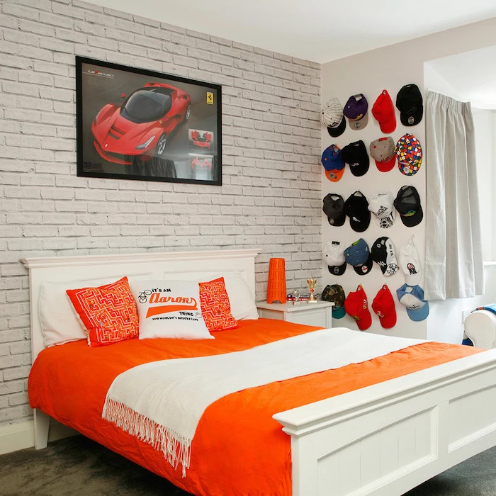 brick wall behind white wooden bef boys bedroom decor red ferrari poster collection of hats hanging on the wall