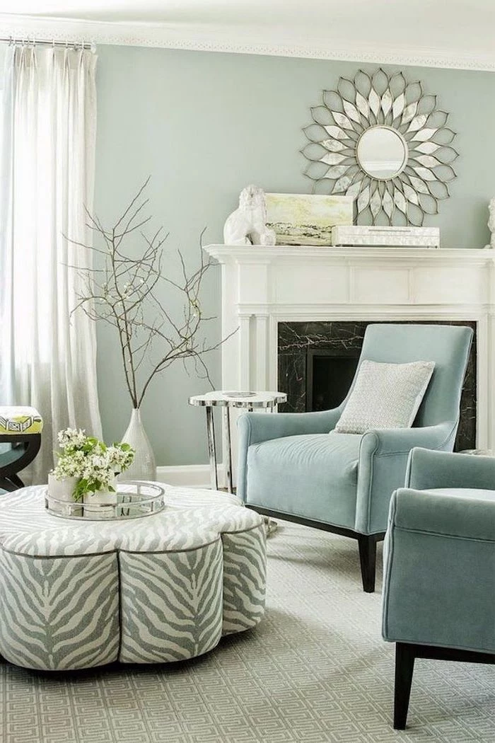 colors that go with grey light turquoise armchairs ottoman with zebra print in front of fireplace very light green walls