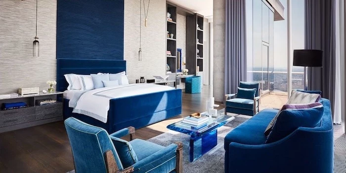cute room ideas blue velvet sofa armchairs backboard bed large bedroom with wooden floor tall windows