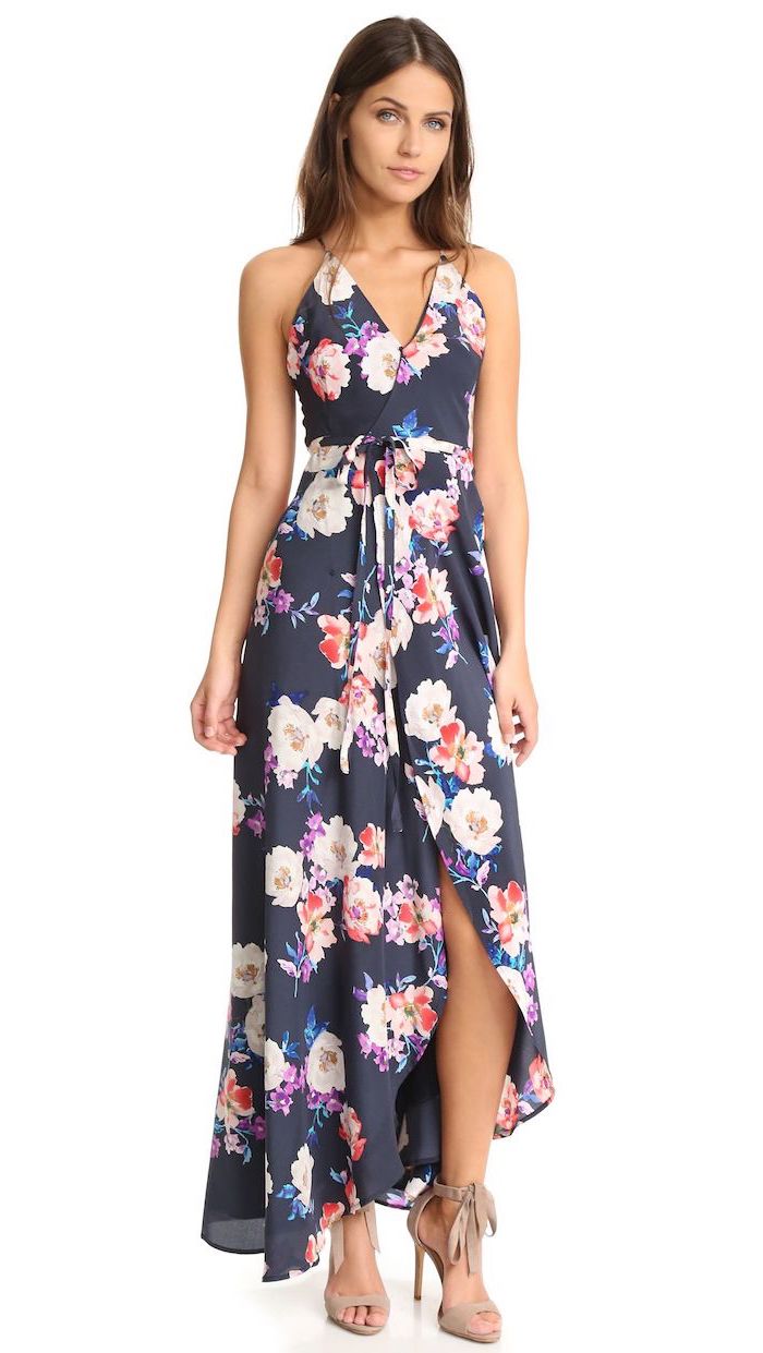 dark blue dress with pink purple flowers white summer maxi dress worn by brunette woman beige velvet sandals