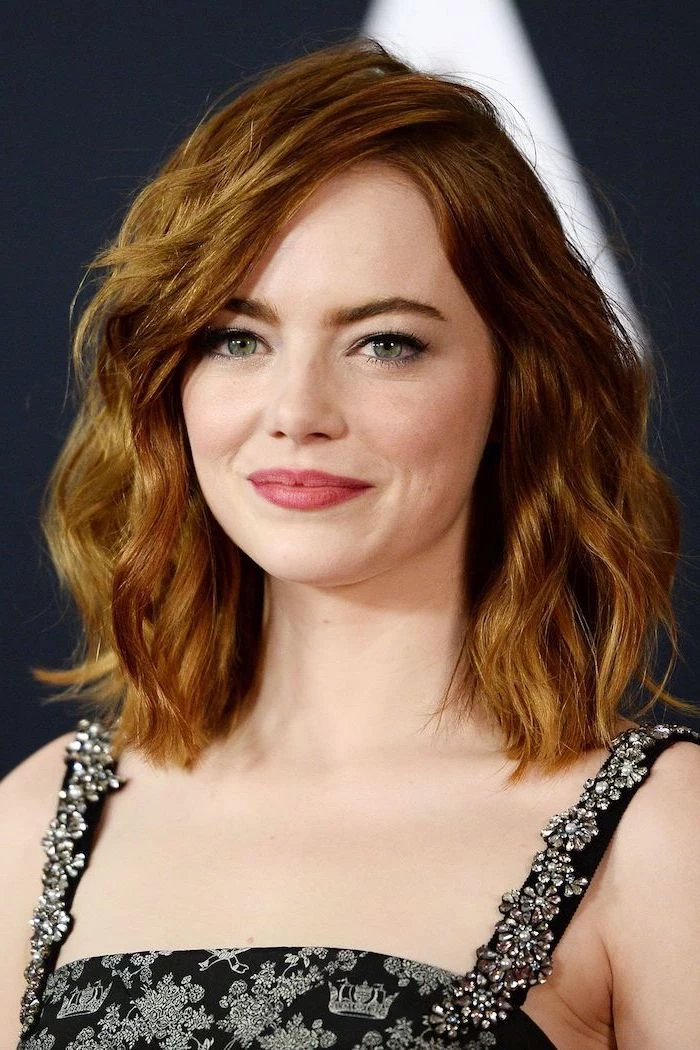 emma stone with red hair shoulder length curly side swept wearing black dress short haircuts for fine hair