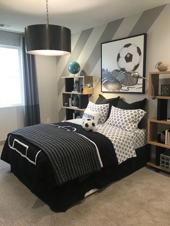 football inspired teen boy bedroom ideas black and white bed sheets two bookshelves on both sides of the bed framed drawing of football and shoes