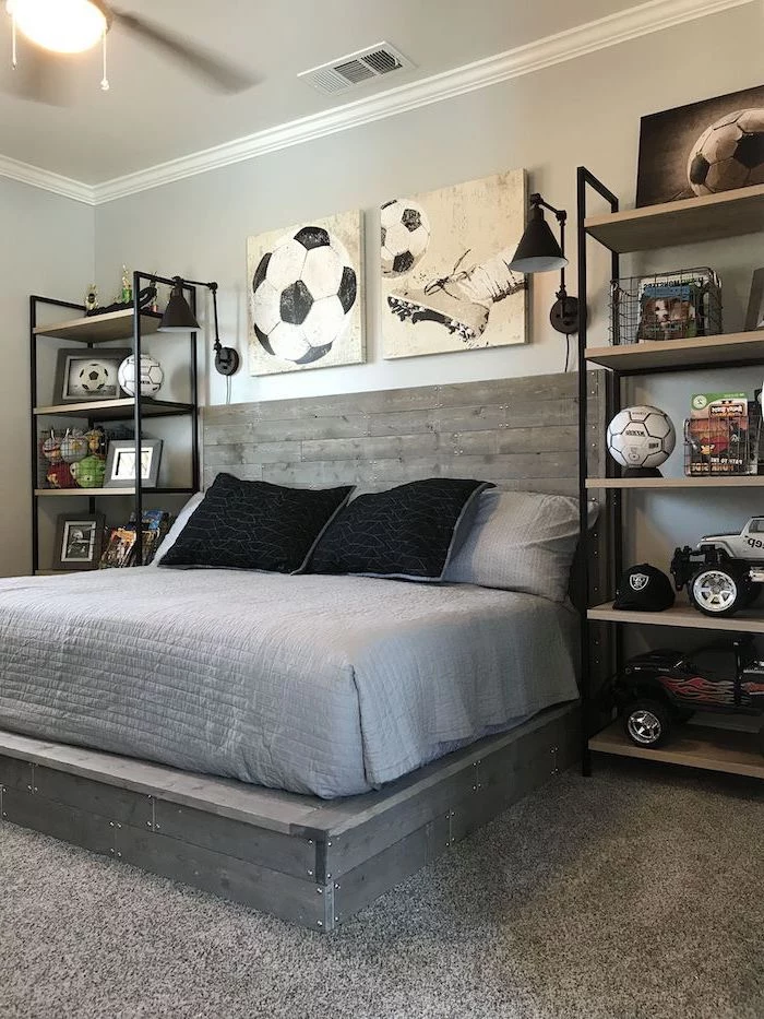 football themed room boys bedroom furniture football posters wooden pallet bed with grey sheets bookshelves on both sides