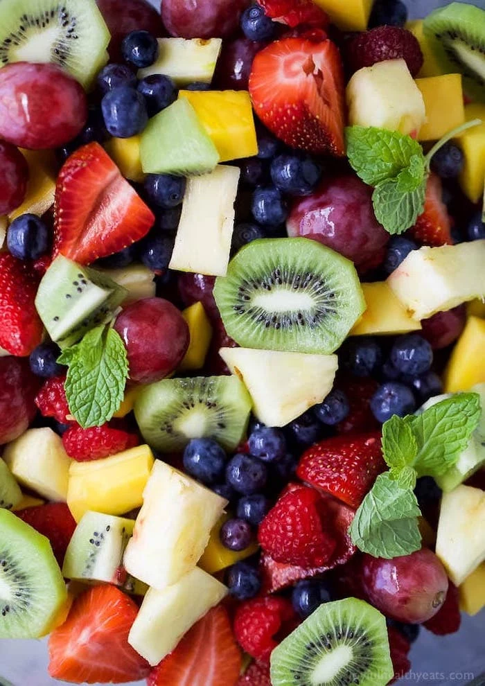 fruit salad with strawberries blueberries grapes mango kiwi pineapple how to make salad mint leaves