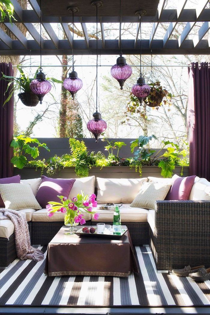 garden furniture set with white cushions patio cover ideas purple throw pillows lamps lots of plants