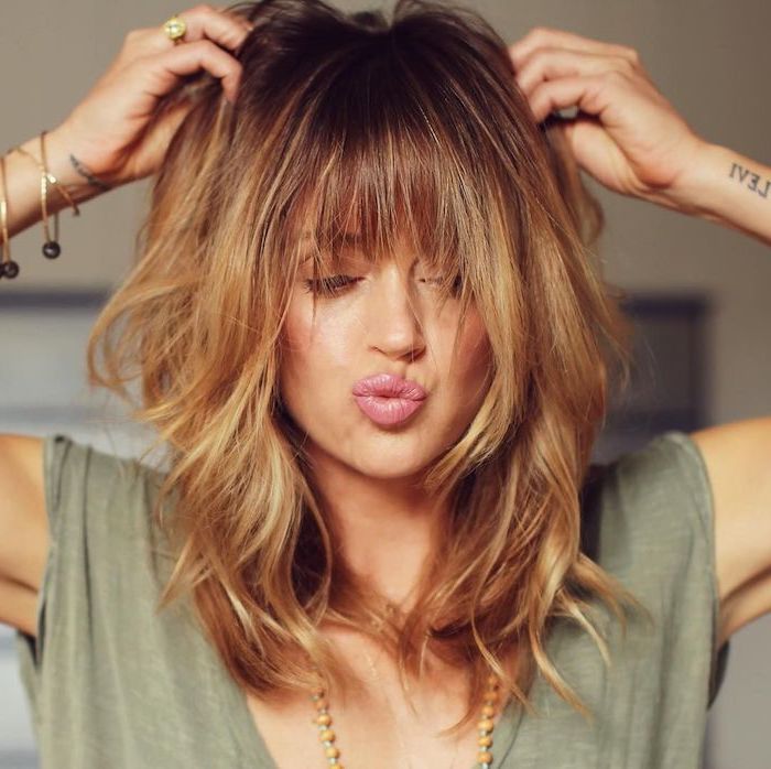 40 Gorgeous Medium Length Hairstyles For Thin Hair To Try In 2021   Girl With Dark Blonde Hair With Blonde Highlights With Bangs Haircuts For Thin Hair Wearing Green Top 