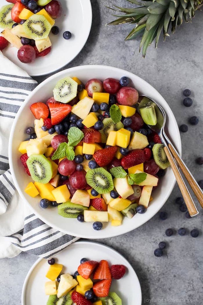 grapes kiwi mango pineapple strawberries blueberries how to make salad inside white bowl