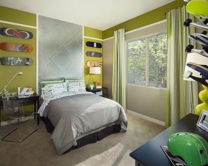 green walls with skateboards hanging on them above the bed boys bedroom ideas small desk on the side of the bed