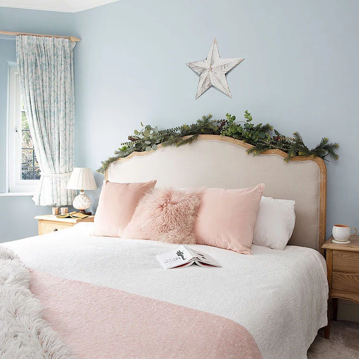 greenery over the bed frame pinterest bedroom ideas bed with white bed sheets pink throw pillows blanket blue walls