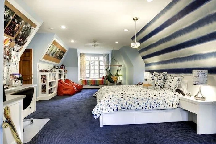 large bedroom with twin bed teen boy bedroom ideas dark blue carpet hammock two puff chairs wooden desk bookshelves