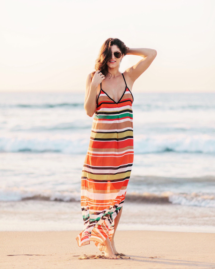 long dress in white black red green brown orange sexy summer dresses worn by brunette woman on the beach