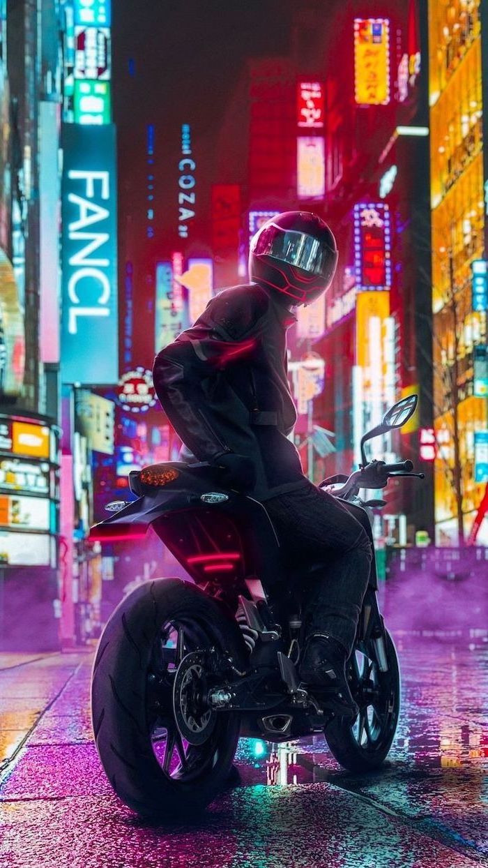 man wearing helmet sitting on motorcycle parked on street wallpapers for guys lots of neon lights on the buildings in the background