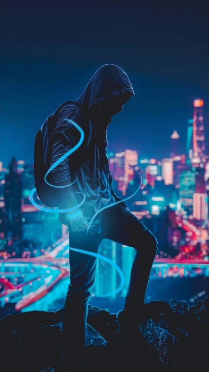 man wearing jeans dark hoodie backpack cool background hd standing overlooking a city at night