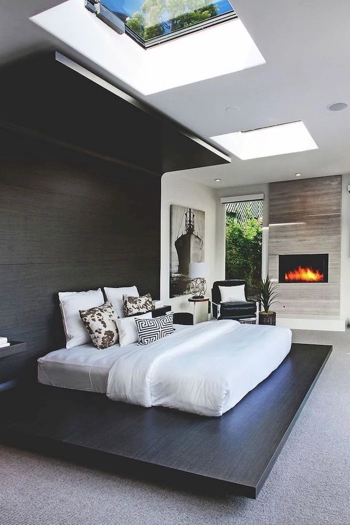 master bedroom ideas with fireplace large black wooden board windows on the ceiling floor covered with grey carpets