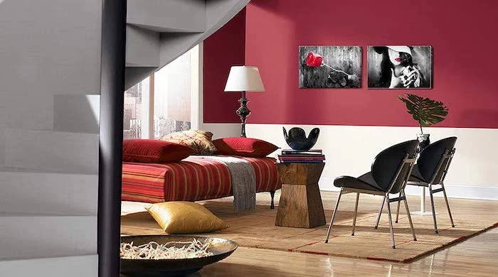 red and white walls with wall art living room paint color ideas two black chairs red ottoman wooden coffee table