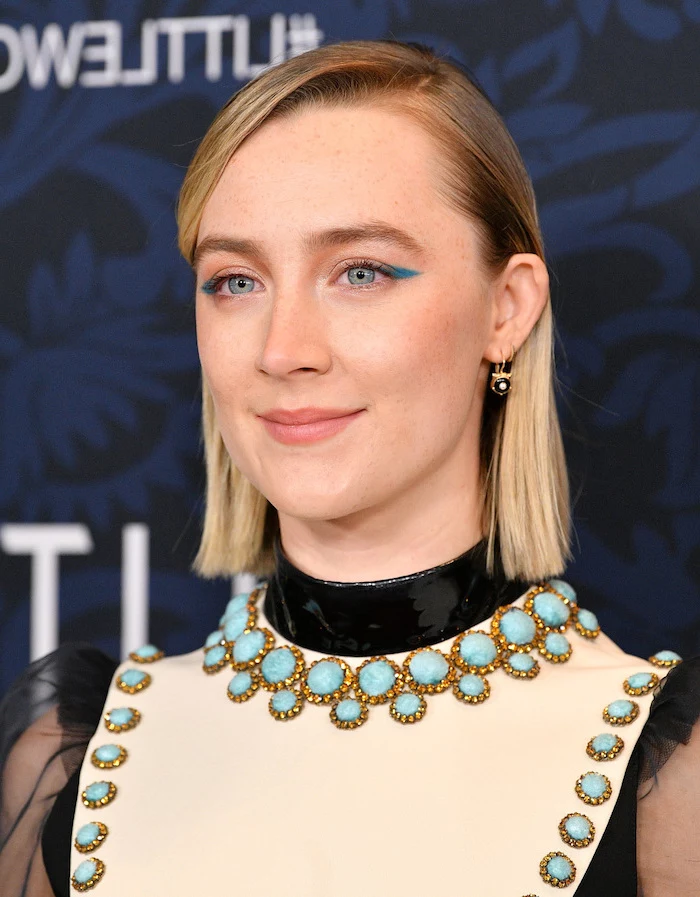 saoirse ronan wearing white and black dress with blue rhinestones haircut for thin hair to look thicker side swept short straightened blonde hair