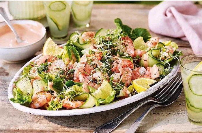 shrimp salad with cucumbers sprouts green salad summer salad recipes lemon sliced on the sides