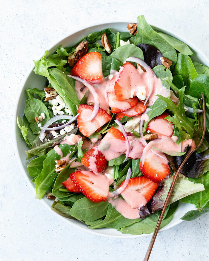 spinach strawberries walnits onion crumbled feta cheese easy salad recipes small white bowl