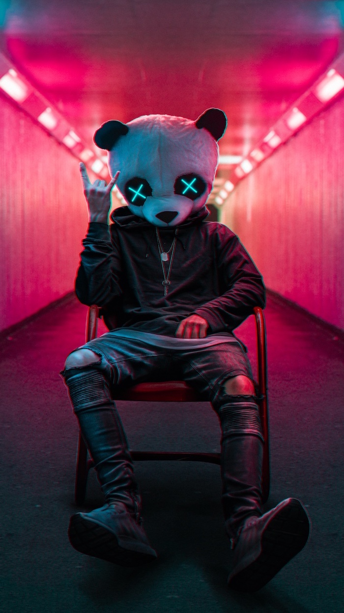 super cool wallpapers man wearing jeans black hoodie panda head with two x for eyes neon lights in the background