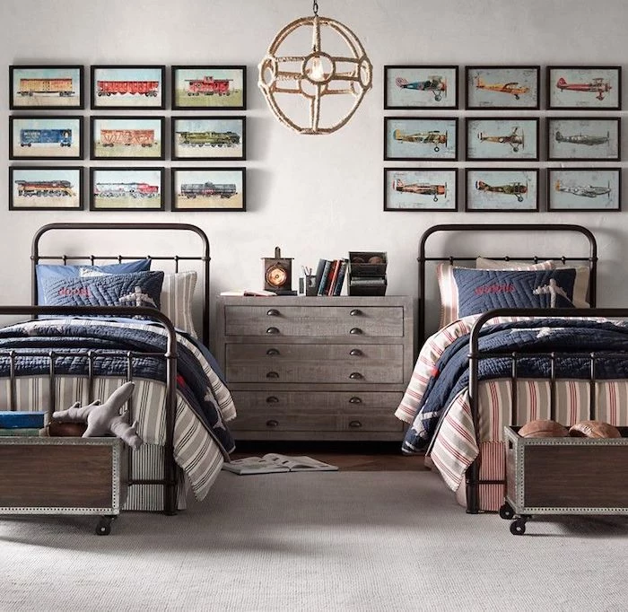 teen boy bedroom ideas two beds with night stand between them framed photos of trains and airplanes above the beds