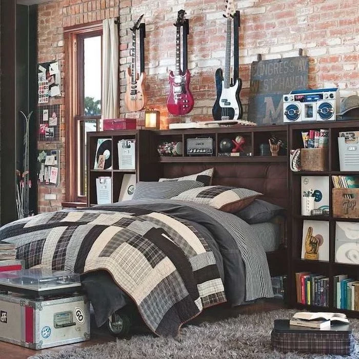 wooden floor with grey carpet boys bedroom ideas brick wall with guitars hanging on it vinyls boombox arranged on shelves around the bed