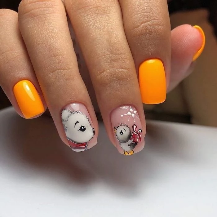 bear and bird decorations on middle and ring fingers orange nail polish on other fingers simple nail designs short squoval nails