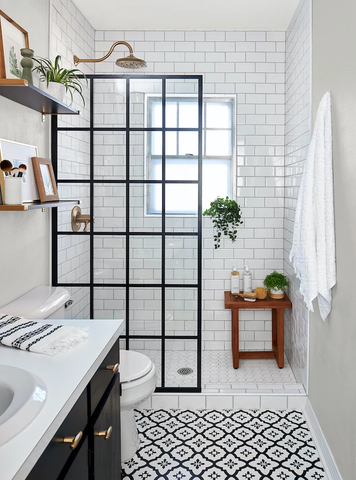 black cabinet with white countertop small bathroom designs with shower black and white patterned floor subway tiles arounf the shower