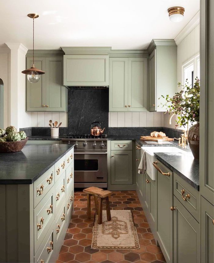 black granite backsplash light pastel green cabinets with black countertops farmhouse white kitchen cabinets honeycomb tiles on the floor