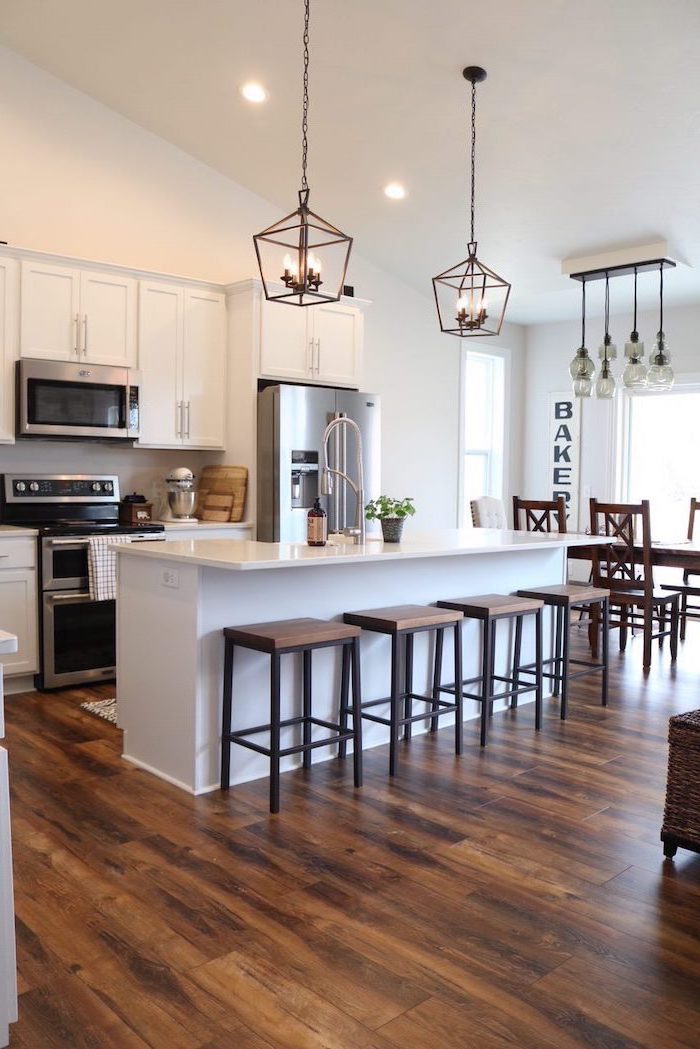 black metal bar stools modern farmhouse decor ideas white kitchen island and cabinets with white countertops dark wooden floor