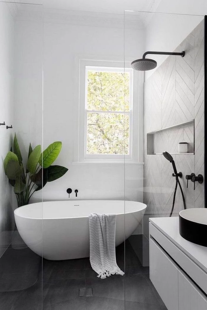 black tiles on the floor grey tiles on the wall in the shower cabin white bathtub bathroom decor pictures