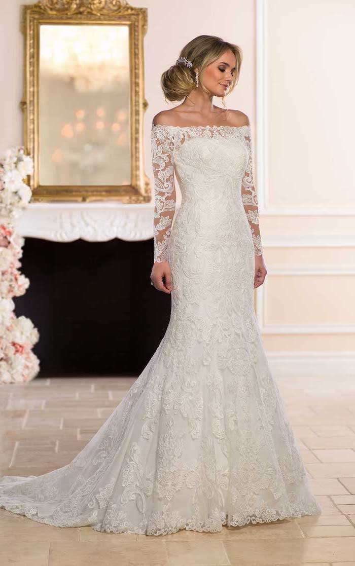 https://archziner.com/wp-content/uploads/2020/08/blonde-woman-with-hair-in-low-updo-wearing-ball-gown-wedding-dress-with-long-sleeves-made-with-lace.jpg