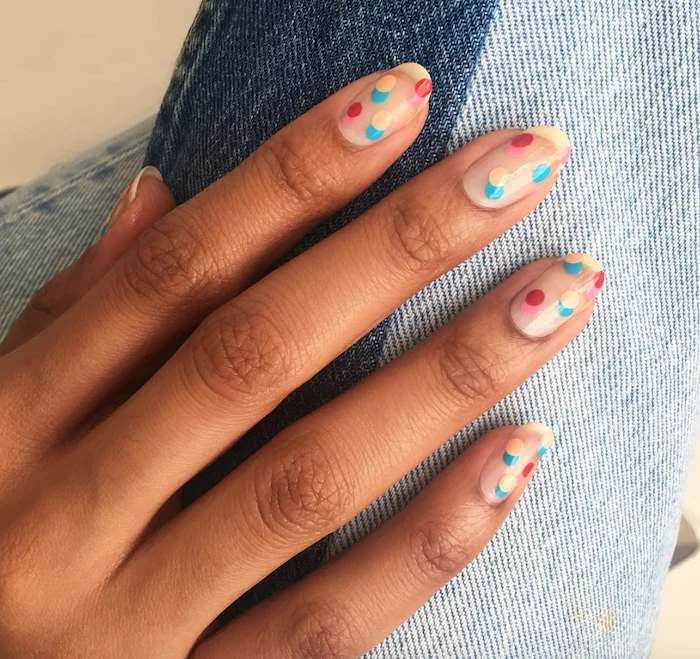 blue yellow pink red dots decorations on transperant nail polish cute acrylic nail designs medium length almond nails