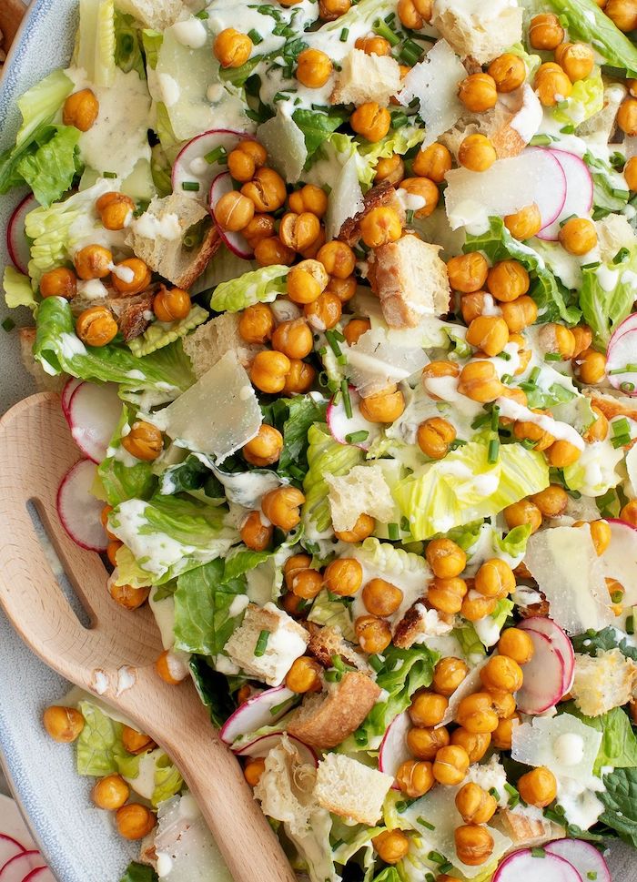 ceaser salad with croutons iceberg lettuce turnip parmesan cheese chickpeas vegan chickpea recipes stirred with wooden spoon