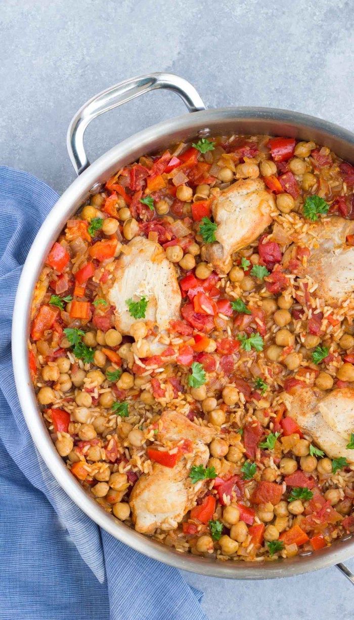 chicken fillet cooked with rice chickpeas tomatoes easy chickpea recipes garnished with parsley