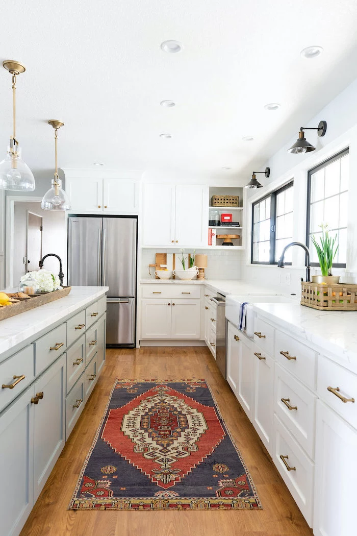 colorful carpet on wooden floor white cabinets with marble countertop white farmhouse kitchen