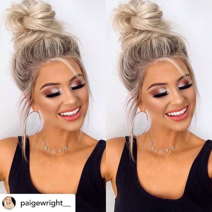 cool hairstyles for girls woman with blonde hair darker roots hair in high bun with loose strands wearing black top
