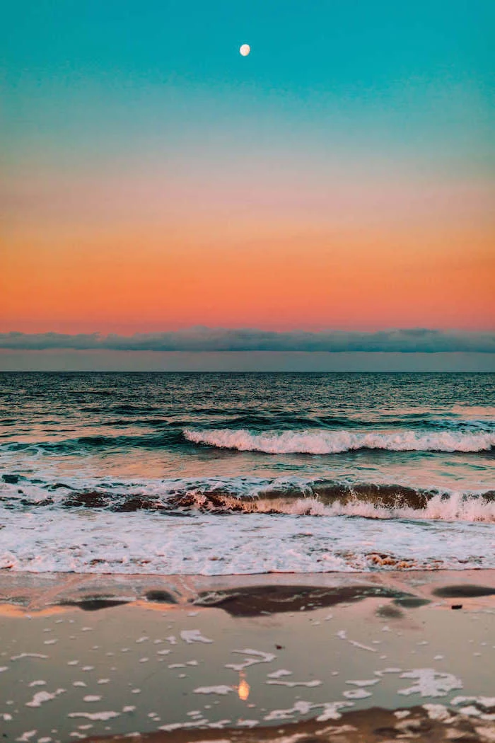cute aesthetic wallpapers photo of ocean with waves at sunset orange blue yellow sky