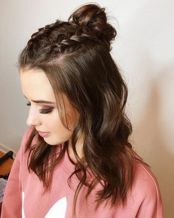 cute easy hairstyles for school woman with brown shoulder length wavy hair two braids on top ending with a bun