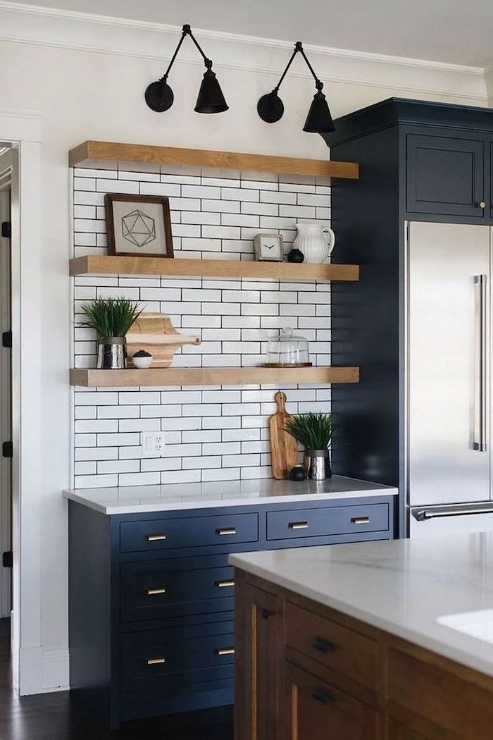dark blue cabinets with white countertops farmhouse kitchen cabinets white subway tiles backsplash wooden shelves wooden kitchen island