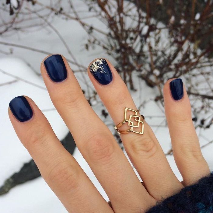 dark blue nail polish on short squoval nails short nail designs gold glitter on the ring finger and golden ring