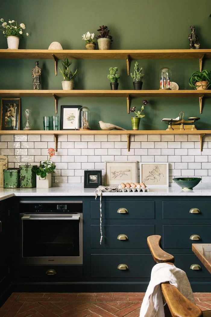 dark green cabinets with white countertop green wall with wooden shelves kitchen backsplash pictures white subway tiles