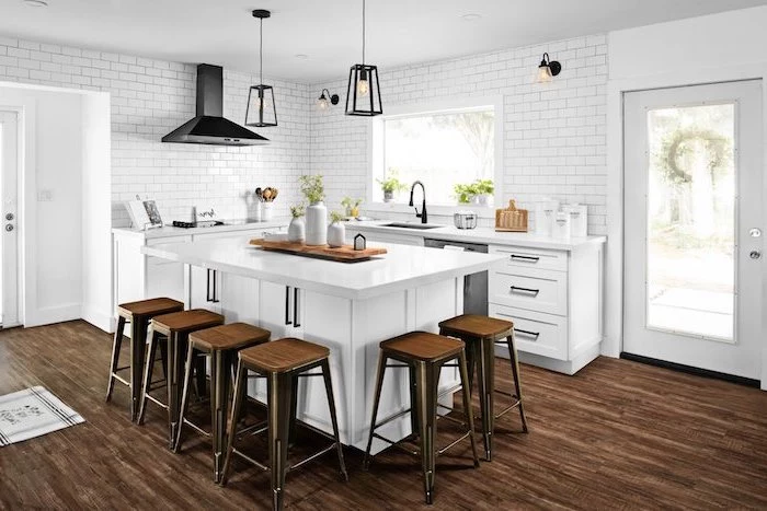 dark wooden floor white subway tiles bar stools around white kitchen island modern farmhouse decor ideas