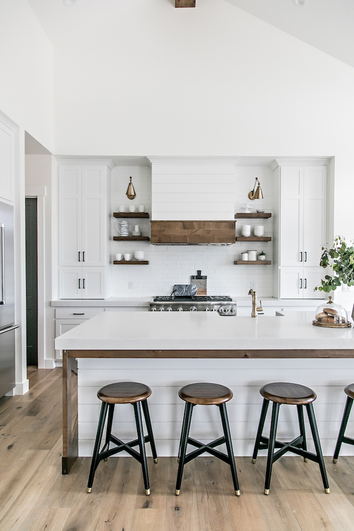 farmhouse kitchen backsplash in white black metal bar stools next to kitchen island with white countertop open shelving