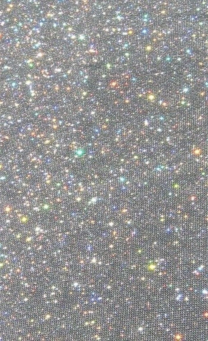 glitter shining in different colors on a piece of fabric in black gray vsco backgrounds