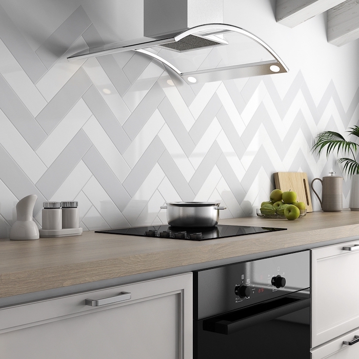 gray and white tiles on the wall glass kitchen hood modern kitchen backsplash white cabinets with wooden countertop