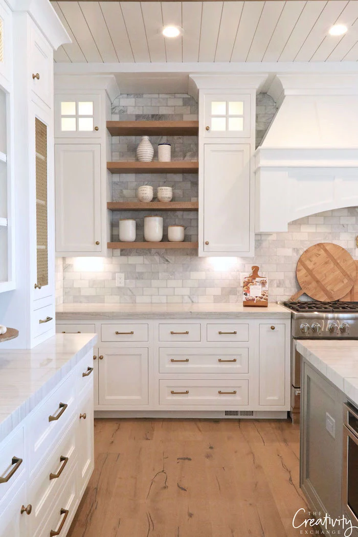 gray tiles in different shades backsplash open shelving modern farmhouse kitchen white cabinets white countertop wooden floor