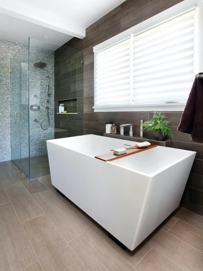 grey mosaic tiles on one wall wooden accent wall floor small bathroom remodel glass shower cabin white bathtub