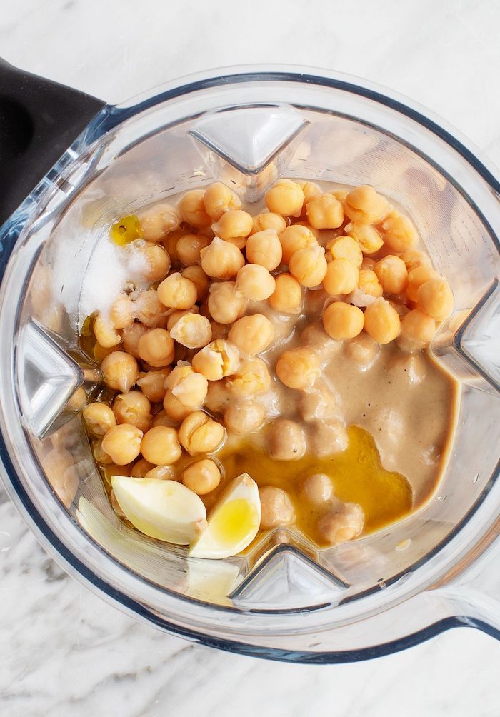 how to make chickpea hummus roasted chickpeas snack ingredients inside blender chickpeas garlic olive oil salt